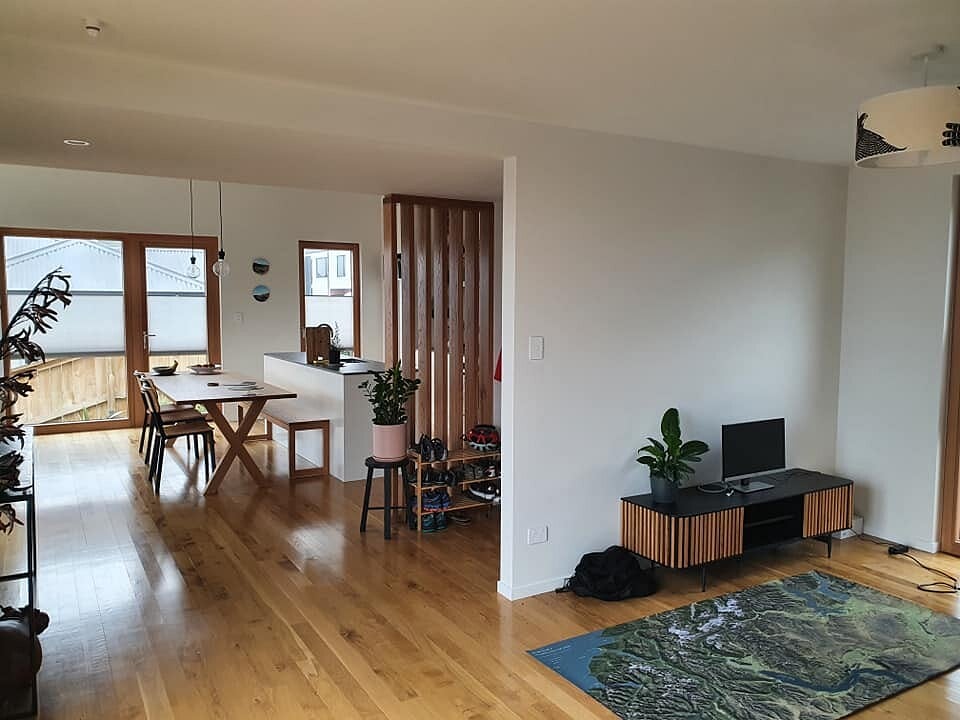 Open-plan kitchen and dining space with polished timber floors